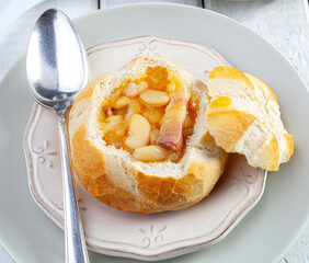 White Bean and Bacon Bread Bowl. Delicious white bean soup served in a bread roll bowl. Perfect for eating on a cold winter day...