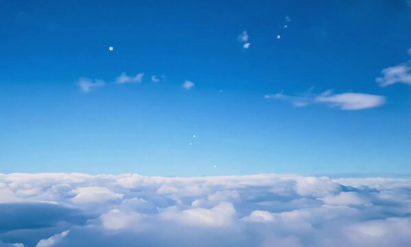 Aerial View of a Sea of Clouds Underneath a Blue Sky with Stars