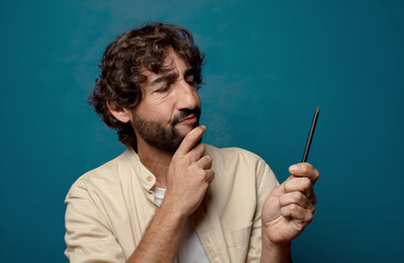 young adult bearded man with a pencil