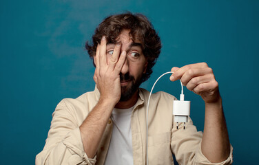 young adult bearded man smartphone charger concept