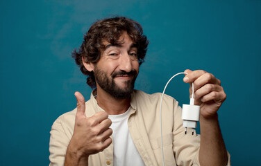 young adult bearded man smartphone charger concept