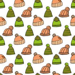 Seamless pattern with green and light orange winter hats on white background.eps