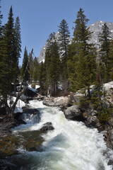 Hiking in the stunning mountain and lake scenery in the Grand Teton National Park, Wyoming