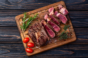 Ribeye grilled  beef steak sliced . Rare doneness photography . Top view