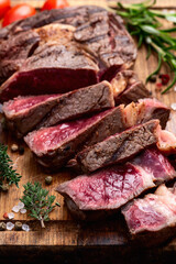 Ribeye grilled  beef steak sliced . Rare doneness photography . Top view