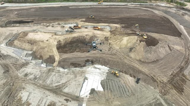 Aerial view of a drone flying over a construction site. 