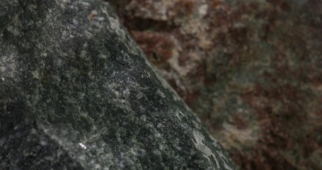 Close-up of a sharp-edged dark green stone