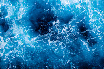 Aerial view of awesome foamy water surface. Can be used in covers, packaging, posters, textures, wallpapers, art, and design projects. Amazing nature background image.