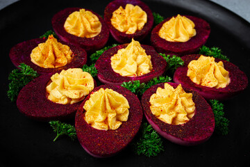 stuffed eggs, stained with beetroot juice, purple, pitaya powder, top view, top view, close-up, no people,
