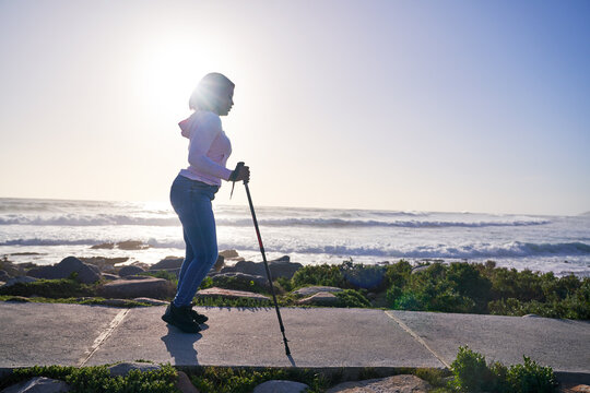 Woman with spastic diplegia cerebral palsy on footpath