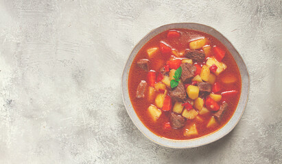 meat goulash, with potatoes and carrots, sweet pepper, traditional Hungarian soup, homemade, no...