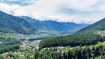 Aerial view of manali with the beas river in himachal pradesh India. Himalayan mountains and colourful local houses nestled in the hills of manali himachal pradesh India.