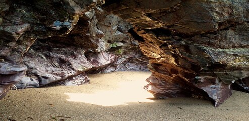 Shimmers of gold in the beach cave at Perranporth