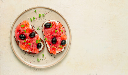 sandwiches with red fish, cream cheese, olives and microgreens, breakfast,