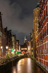 Naklejka premium City scenic from Amsterdam by night in the Netherlands