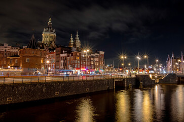 Fototapeta premium Amsterdam by night with the St. Nicolas church in the Netherlands