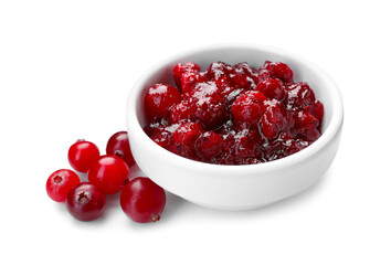 Tasty cranberry sauce in bowl and berries isolated on white