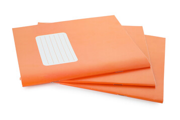 Orange copybooks isolated on white. School stationery