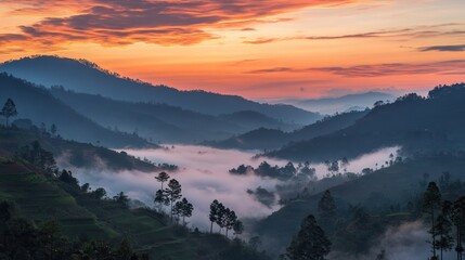 Obraz premium Serene landscape at dawn with misty valleys and vibrant skies.