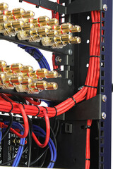 Connection of electronic modules in a multimedia telecommunication rack. Soft focus. 