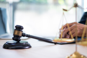 Judge's gavel on table in lawyer's office and