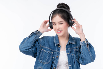 Happy Asian Woman in Denim Jacket Smiling Joyfully While Wearing Headphones, Enjoying Music and Relaxing with a Cheerful and Positive Expression isolated on white background