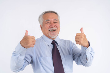 Elderly man wearing a business shirt and tie giving double thumbs up with a happy and confident smile, expressing approval, success, positivity, and encouragement, isolated on white background