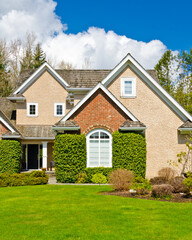 Fragment of  luxury house in summer with green trees and nice landscape in Vancouver, Canada, North America. Day time on June 2024