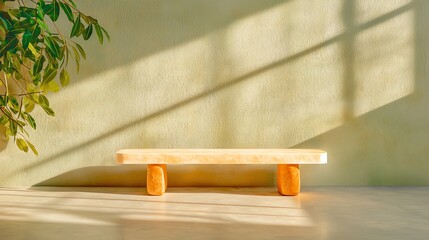 Minimalist wooden table with natural light and a plant backdrop.
