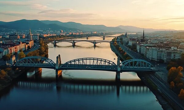 Panoramic Sunset View of Maribor, Slovenia, Showcasing Bridges and River Drava
