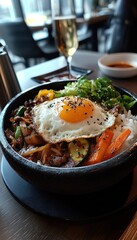 A delicious bowl of rice topped with vegetables and a fried egg in a restaurant setting.