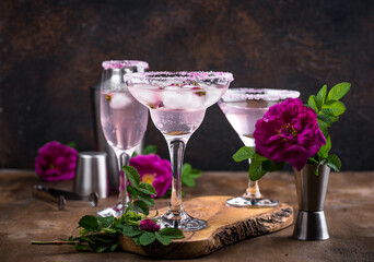 Assortment of pink cocktails with rose syrup.