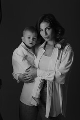 Mother and son. In mother's arms.