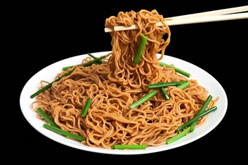 A photo of a golden brown plate of twisted noodles interspersed with green sliced vegetables