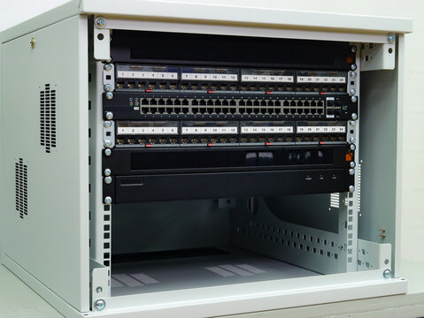 Telecommunication rack with Internet equipment, multimedia amplifiers, video surveillance system. Uninterruptible power supply. Soft focus. 