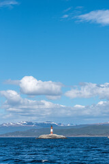 Les Eclaireurs lighthouse with vast blue sky and Beagle Channel