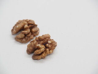 Walnuts on white background, raw food
