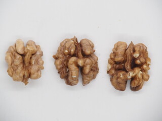 Walnuts on white background, raw food
