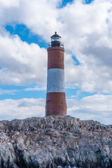 Les Eclaireurs lighthouse with cormorants on rocky terrain in Beagle Channel