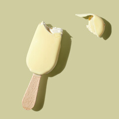 White hocolate ice cream on a stick on white background