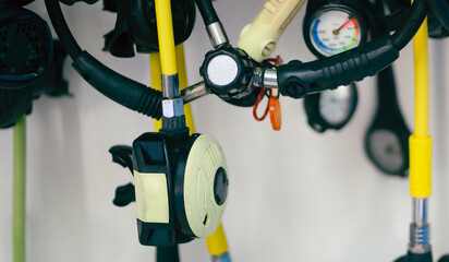 A diving equipment with regulators and tools for checking barrels.