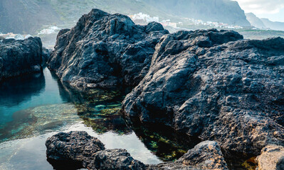 A natural ocean pool with volcanic dark formations in the Garachico, Tenerife island.