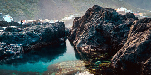 A natural ocean pool with volcanic dark formations in the Garachico, Tenerife island.
