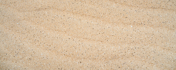 Sandy yellow waves, formations in a desert, textured nature background.