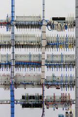 The reverse side of the electrical switchboard. The connected wires are tied with plastic ties.