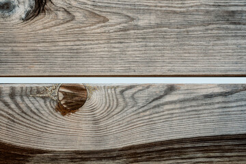 Image of wooden planks with changeable color textures. The light brown wood has characteristic...