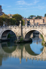 Naklejka premium Rome, Italy - October 9, 2020: Aelian Bridge (Ponte Sant'Angelo) across the the river Tiber, completed in 2nd century by Roman Emperor Hadrian. It leads to Castel Sant'Angelo