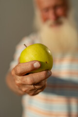 Aging Gracefully: Embracing Nature's Bounty with a Fresh Apple in Hand