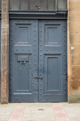 Old Wooden Street Door Painted Grey with Stone Surround