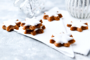 Christmas cookies (cinnamon stars) on bright background. Close up.
